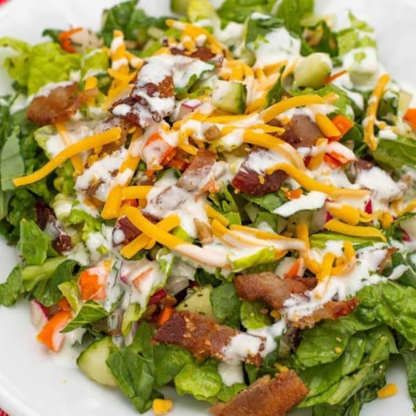 Grille No. 13's American salad with lettuce, bacon, shredded cheese, and creamy dressing.